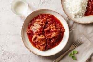 araignée de porc sauce tomate
